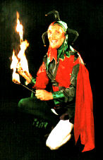 The Jolly Jester in classical jester costume shown here with fire clubs ready to do a show at Hatfield House